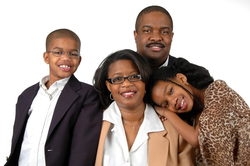 Family with formal attire over a white blackground